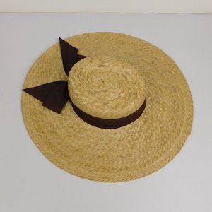 wide brimmed sun hat with hair pick